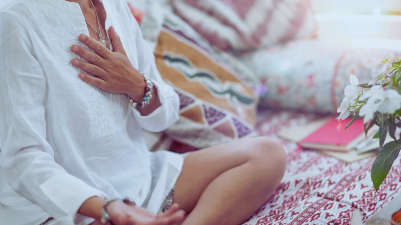 A quiet moment of reflection, hand over heart
