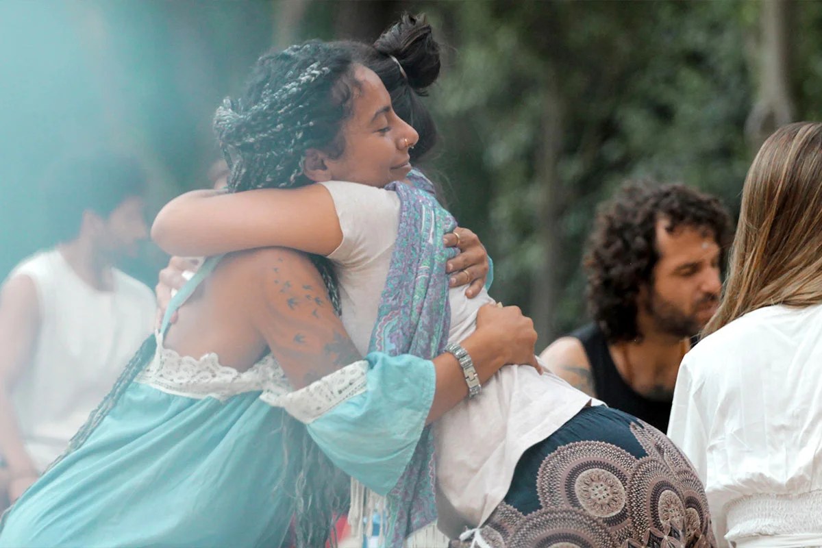 Two people embracing in a supported integration circle