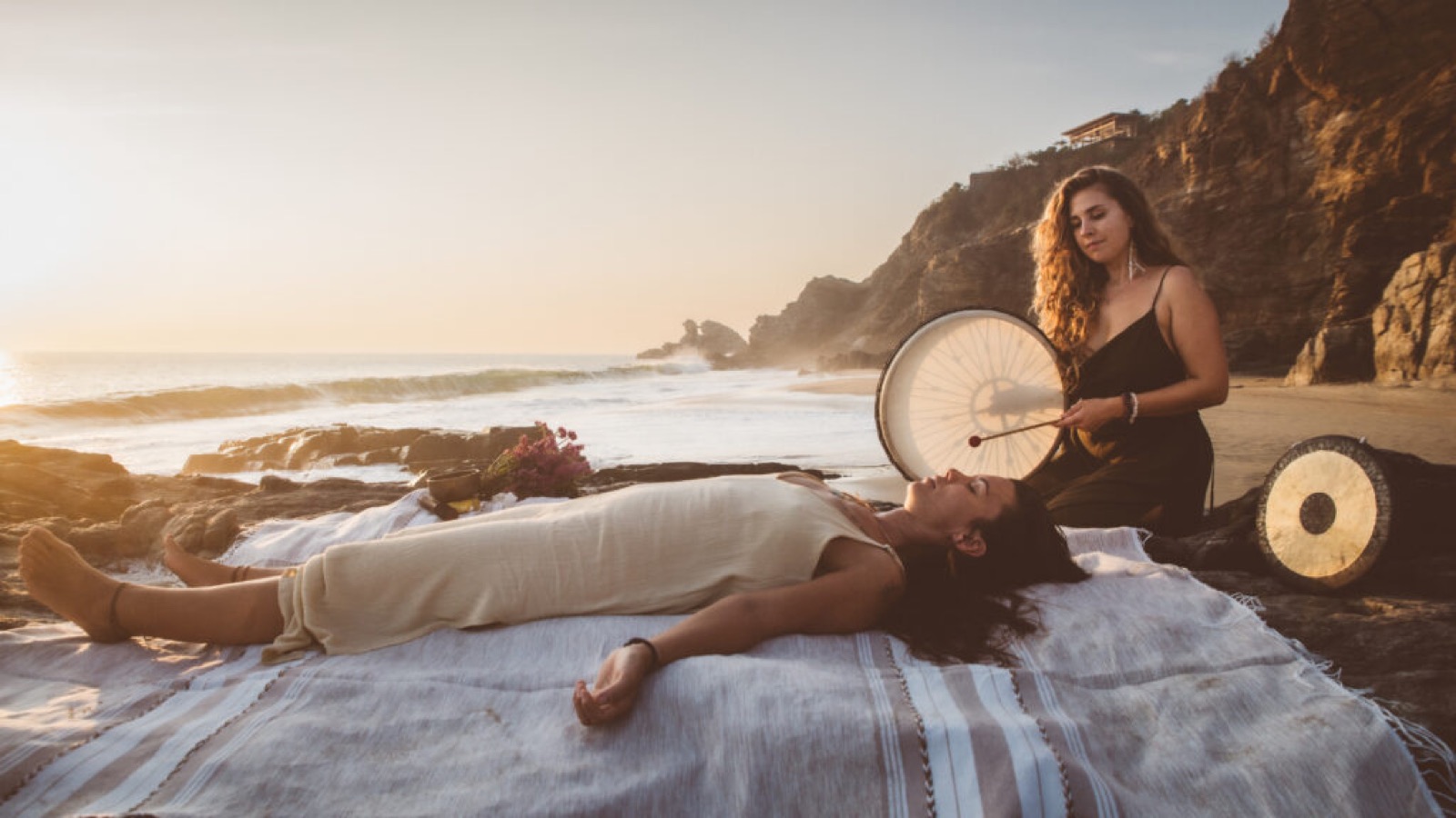 Sound healing ceremony on the beach at sunset